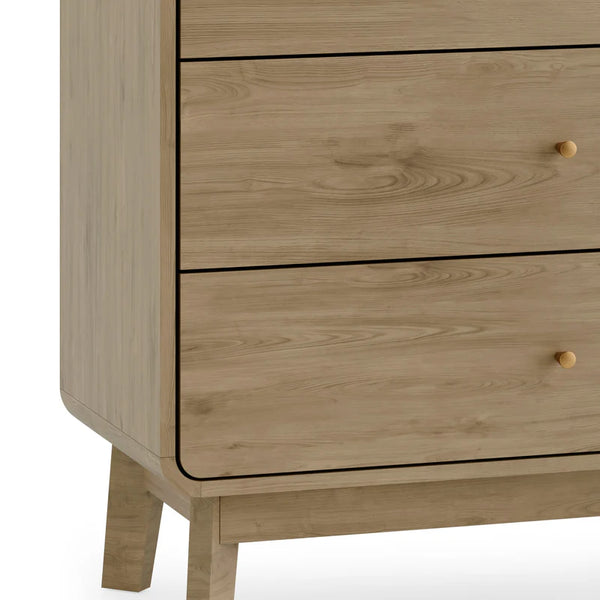 Wooden dresser with three drawers on a white background