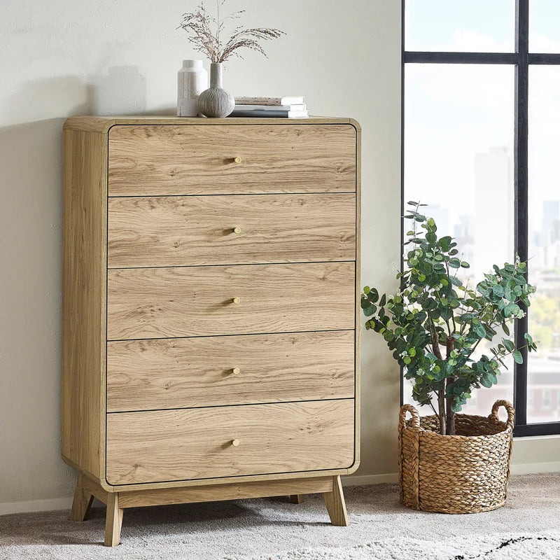 Wooden dresser with five drawers on a white background