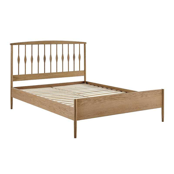 Wooden bed frame with slatted bed base on a white background