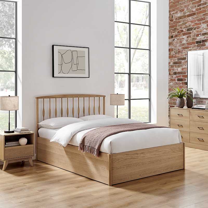 Wooden bed frame with white mattress on a white background