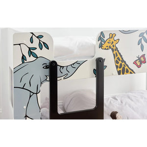 Children's room with a bed and animal-themed safety fence.