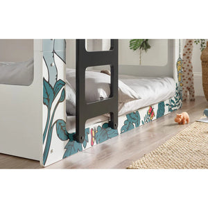 Children's bed with floral design and toys on a wooden floor.