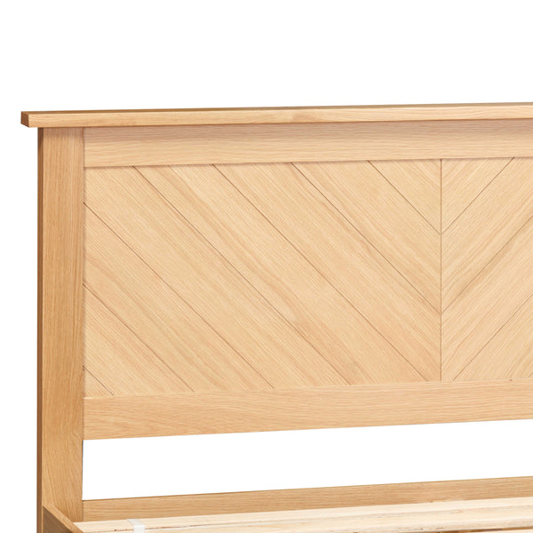 Wooden headboard with a chevron pattern on a white background