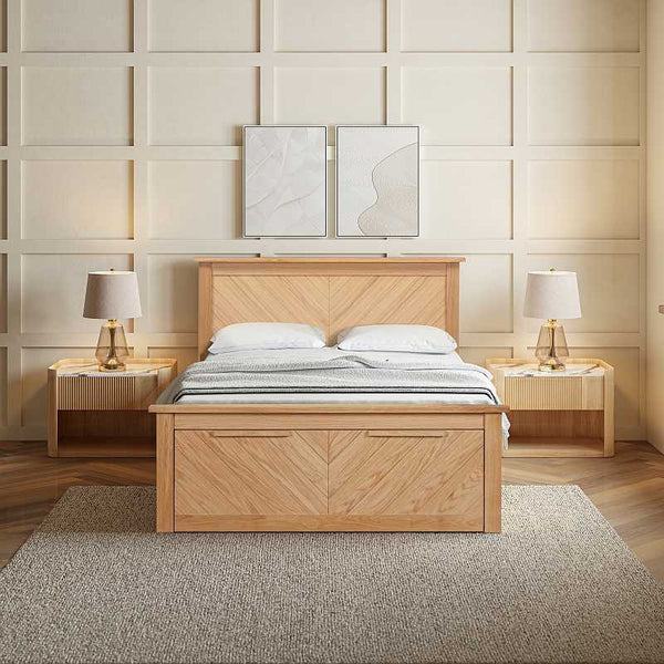 Wooden bed with matching nightstands and lamps in a bedroom setting.