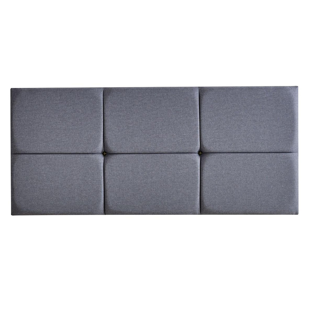 Gray upholstered headboard with a modern design on a white background
