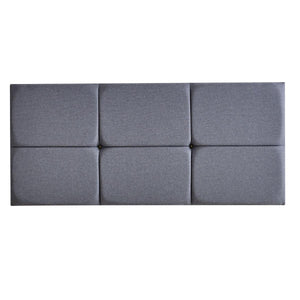 Gray upholstered headboard with a modern design on a white background