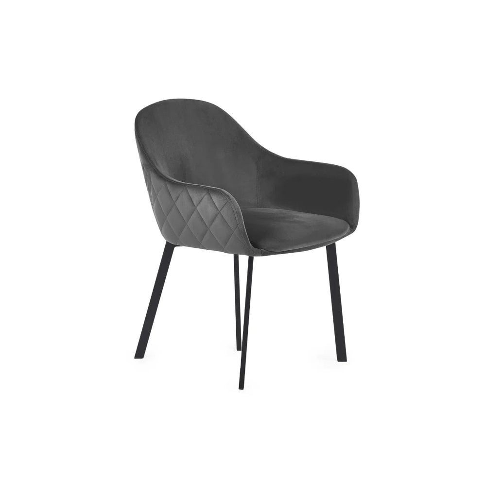 Dark gray armchair with quilted backrest on a white background