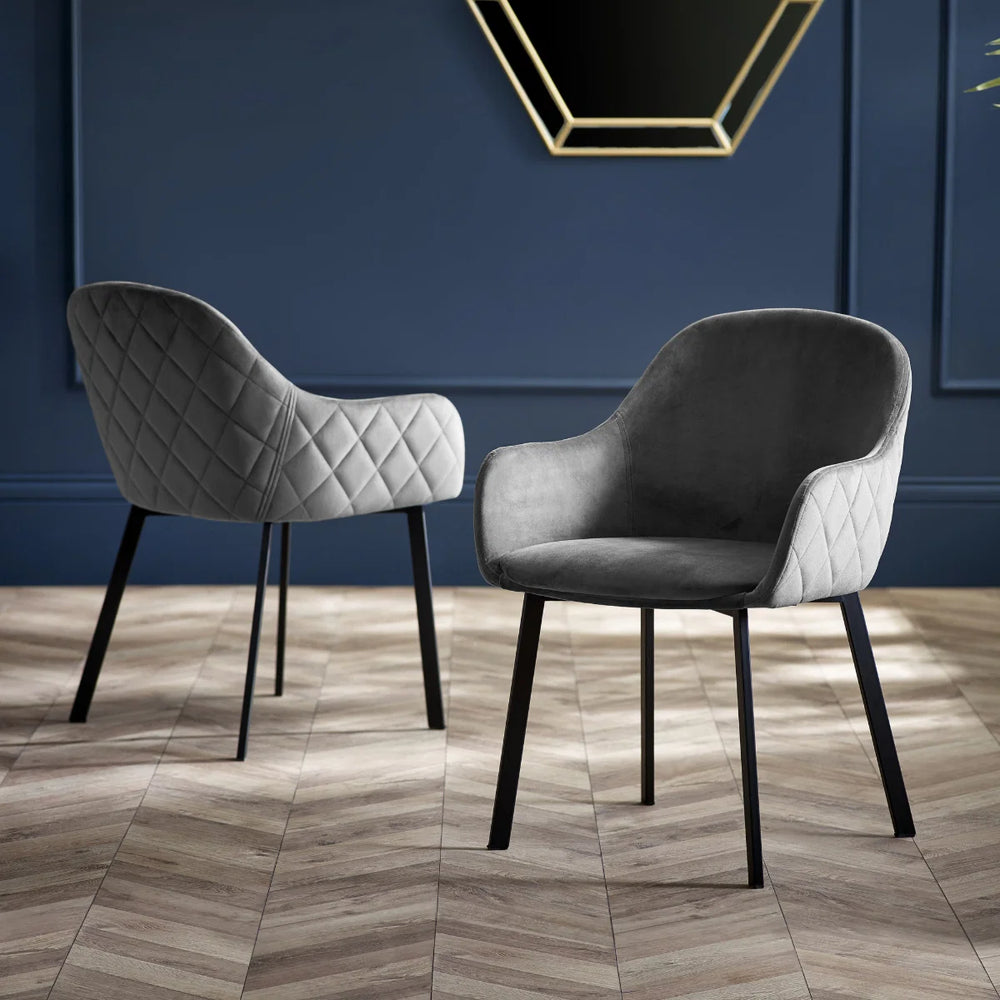 Dark gray armchair with quilted backrest on a white background