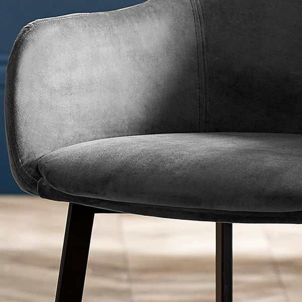 Gray upholstered chair with a blurred background