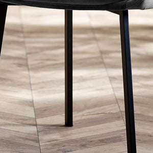 Close-up of a chair leg on a wooden floor