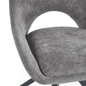 CLOSE UP OF A GREY DINING CHAIR 