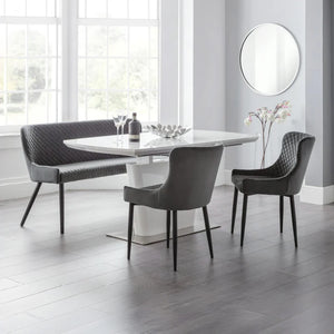 Modern dining set with a table and chairs in a bright room.