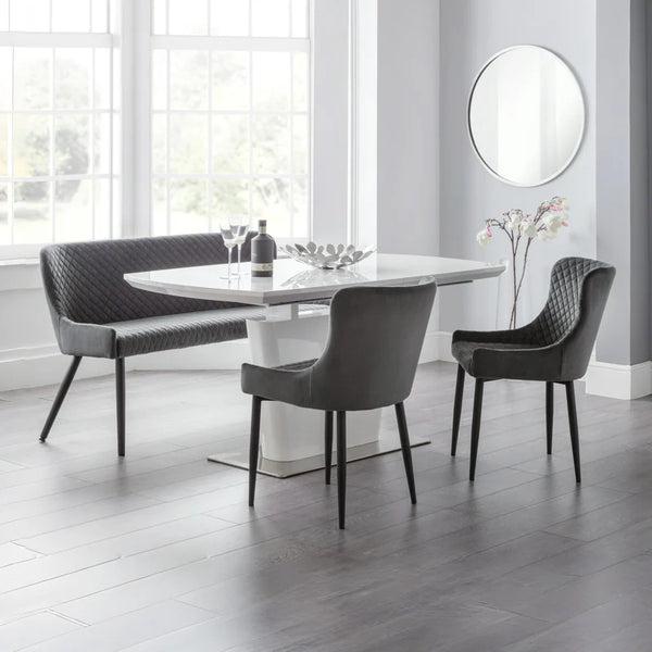 Modern dining set with a table and chairs in a bright room.