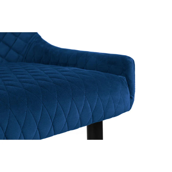 Blue quilted sofa armrest on a white background