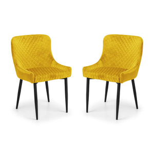 Two yellow chairs with quilted design on a white background