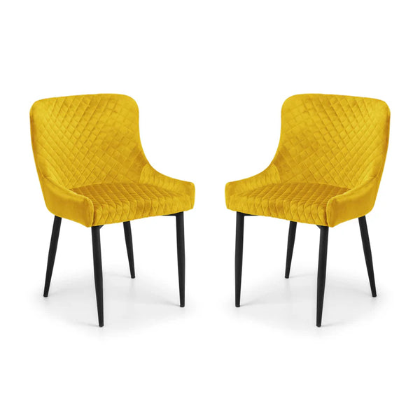 Two yellow chairs with quilted design on a white background
