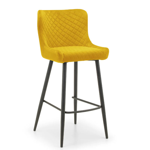 Yellow bar stool with quilted backrest on a white background