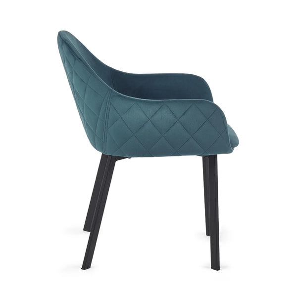 Teal quilted chair with black legs on a white background