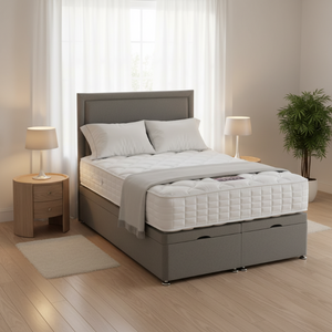 Gray bed frame with white mattress and pillows in a bedroom setting.