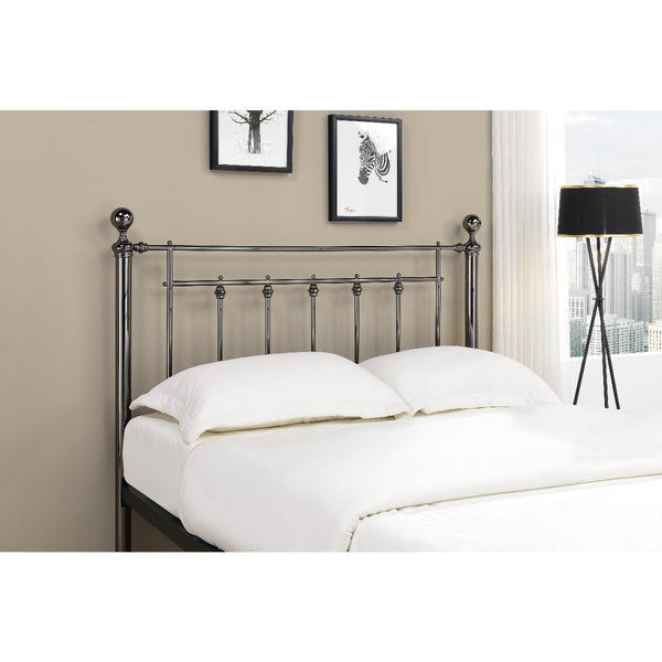 Metal headboard with white bedding in a bedroom setting
