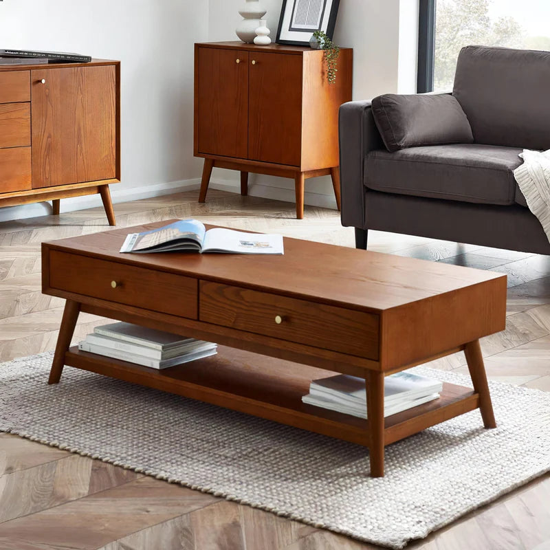 Wooden coffee table with two drawers on a white background