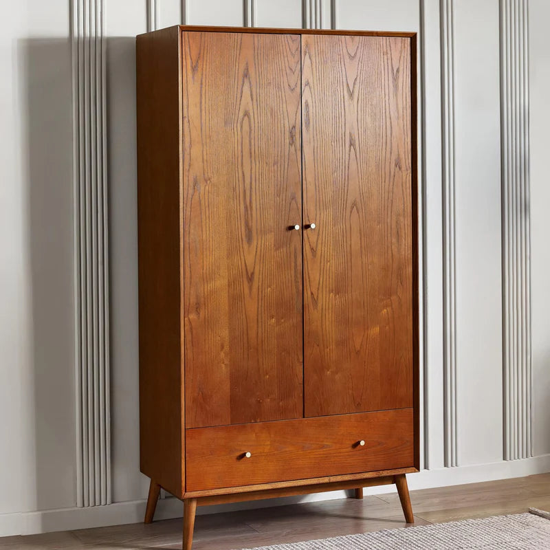 Wooden wardrobe with two doors and two drawers on a white background