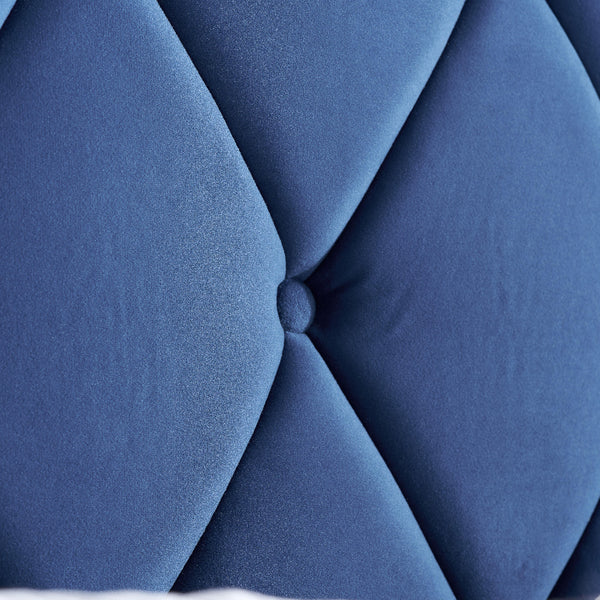 Close-up of a blue tufted fabric surface