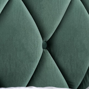 Close-up of a green tufted headboard