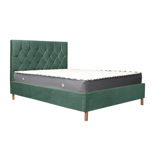 Green upholstered bed with mattress on a white background