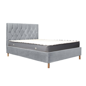 Gray upholstered bed with mattress on a white background
