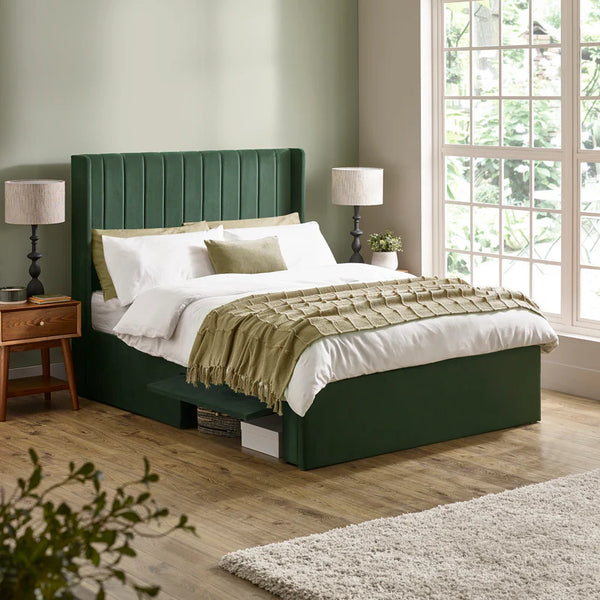 Luca bed frame green roomshot made up with open drawers