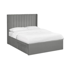 Grey bed frame with white bedding on a white background