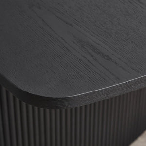 Close-up of a dark wooden surface with a textured finish