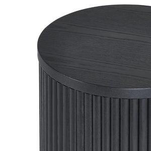 Round wooden side table with a ribbed cylindrical base on a white background
