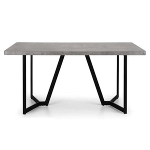 Modern dining table with concrete top and black metal legs on a white background