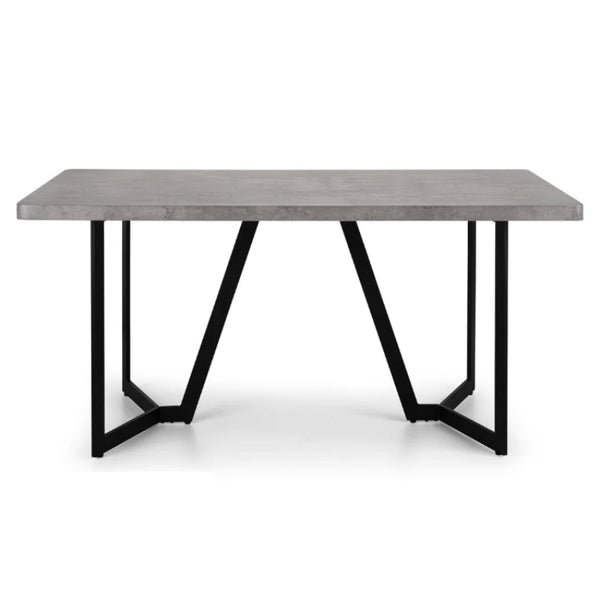 Modern dining table with concrete top and black metal legs on a white background