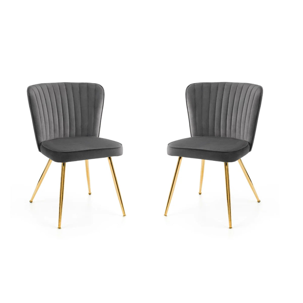 2 GREY DINING CHAIRS WITH GOLD METAL LEGS ON A WHITE BACKGROUND