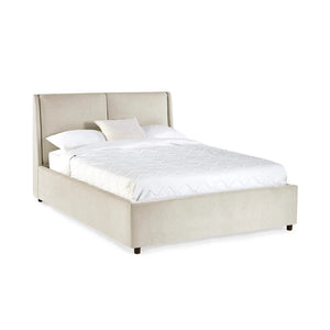 Beige upholstered bed with white bedding on a white background