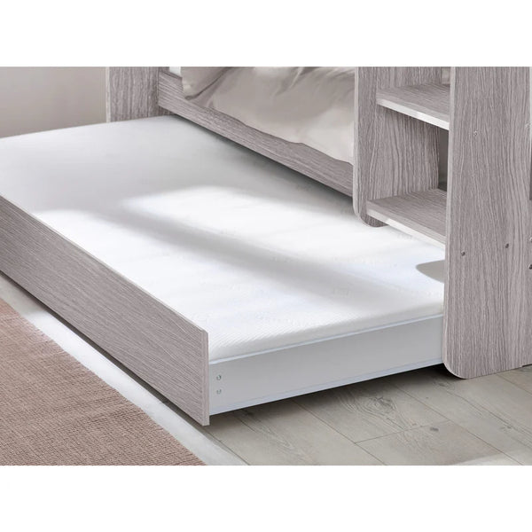 Wooden bed frame with a white mattress on a wooden floor.