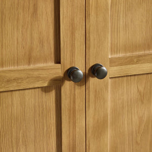 Close-up of wooden cabinet doors with metal handles
