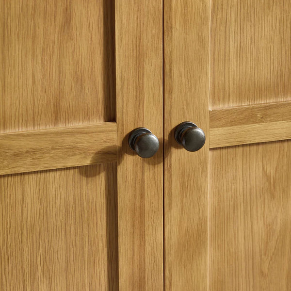 Close-up of wooden cabinet doors with metal handles