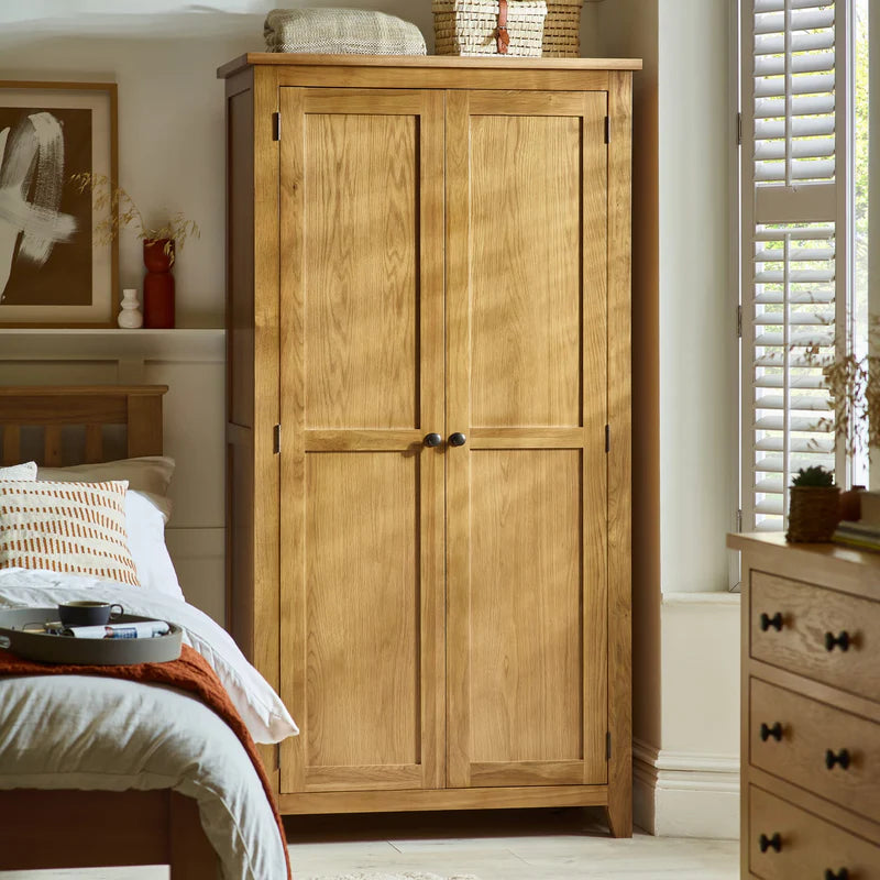 Wooden wardrobe with two doors on a white background
