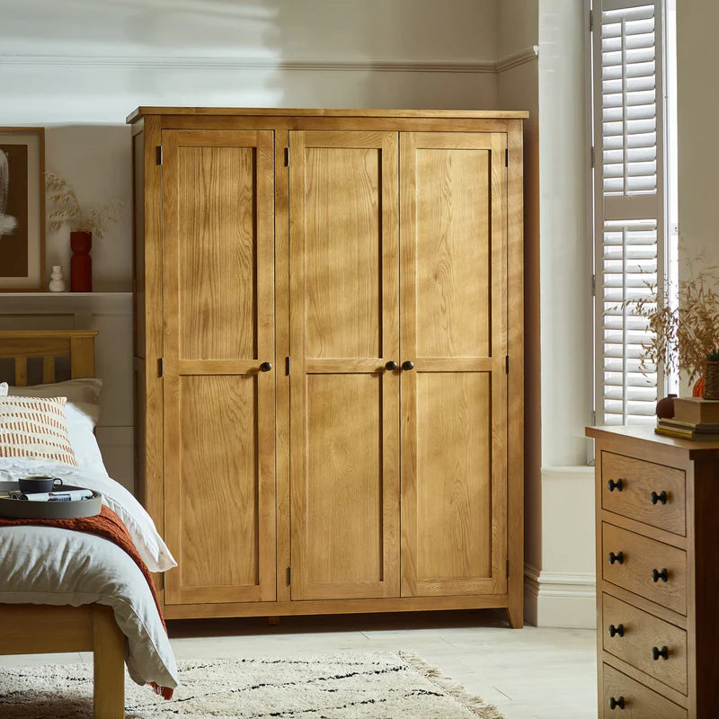 Wooden wardrobe with four doors on a white background
