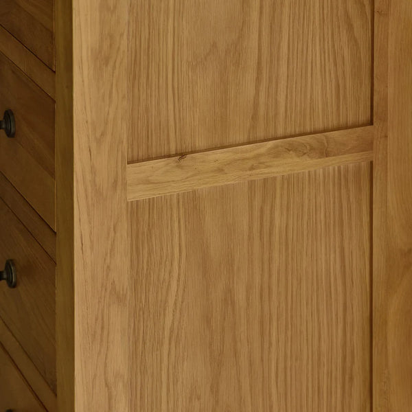 Close-up of a wooden cabinet door with a visible grain pattern