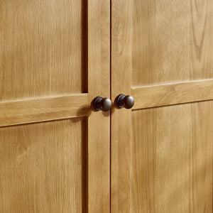 Close-up of wooden cabinet doors with dark handles