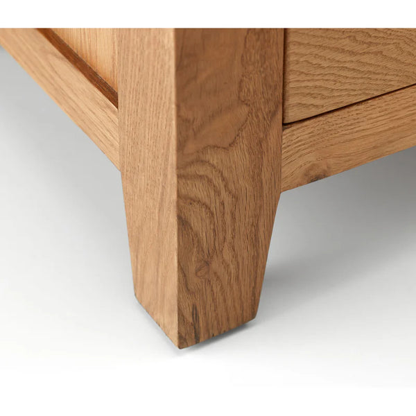 Close-up of a wooden drawer corner on a white background