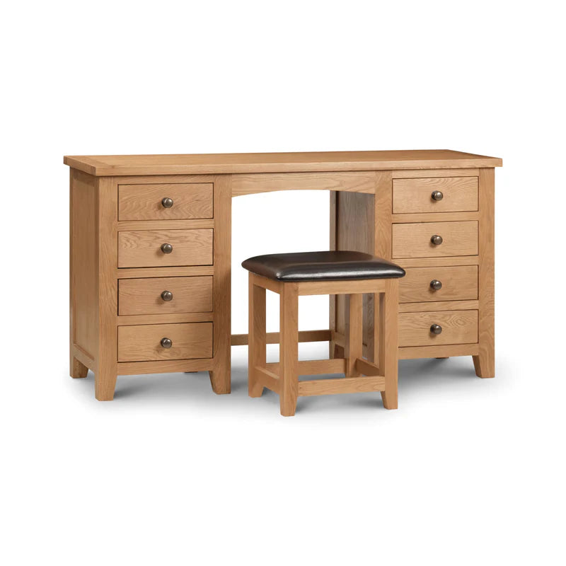 Wooden desk with multiple drawers and a matching stool on a white background