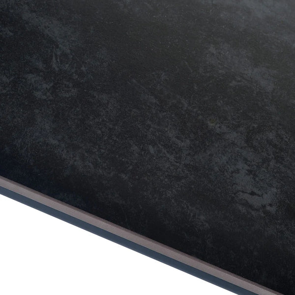 Close-up of a dark gray stone surface with a subtle pattern