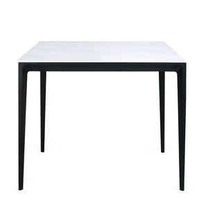 Small table with a white top and black metal legs on a white background