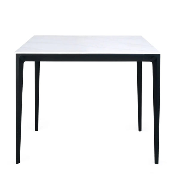 Small table with a white top and black metal legs on a white background